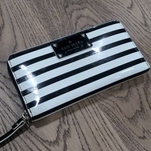 Kate Spade wallet with many compartments and zipper.